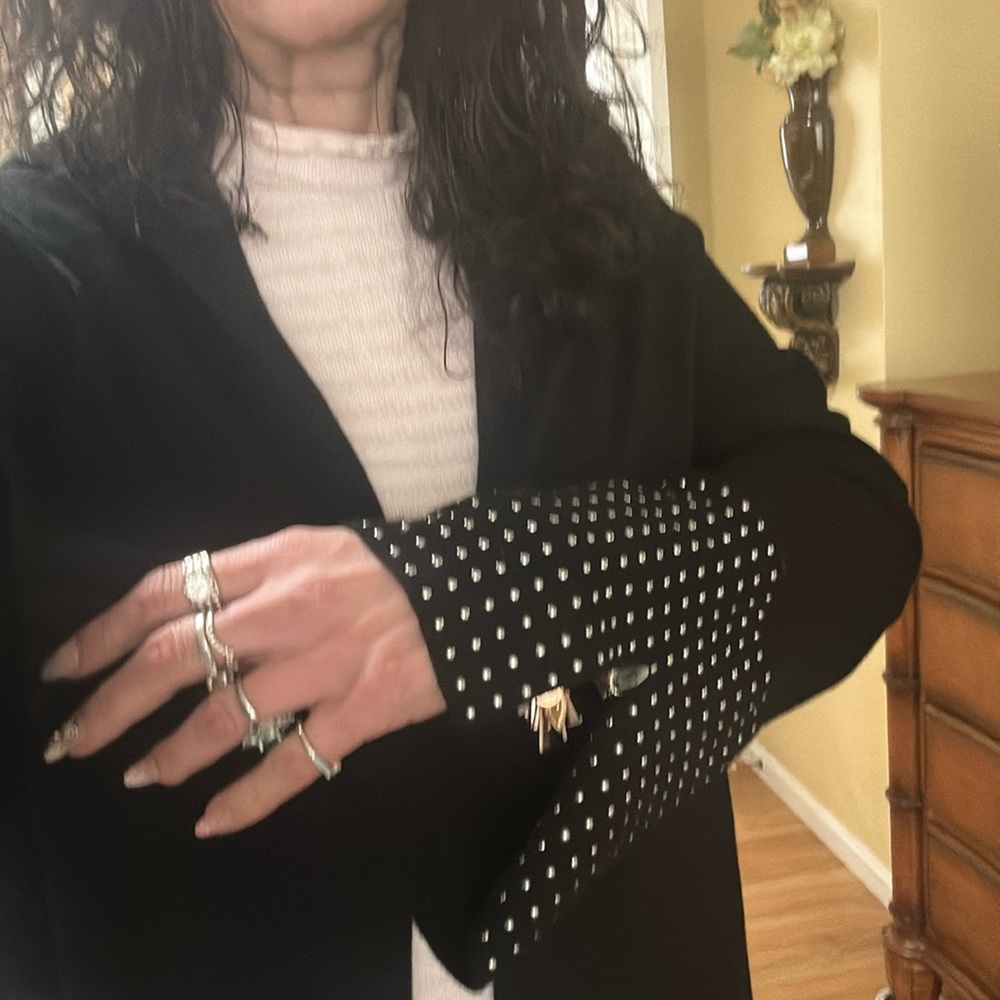 It’s a black sweater jacket that you can wear over anything